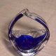 Ashtray in transparent and blue blown glass with a design shape