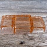 Glass condiment service in transparent pink moulded glass.