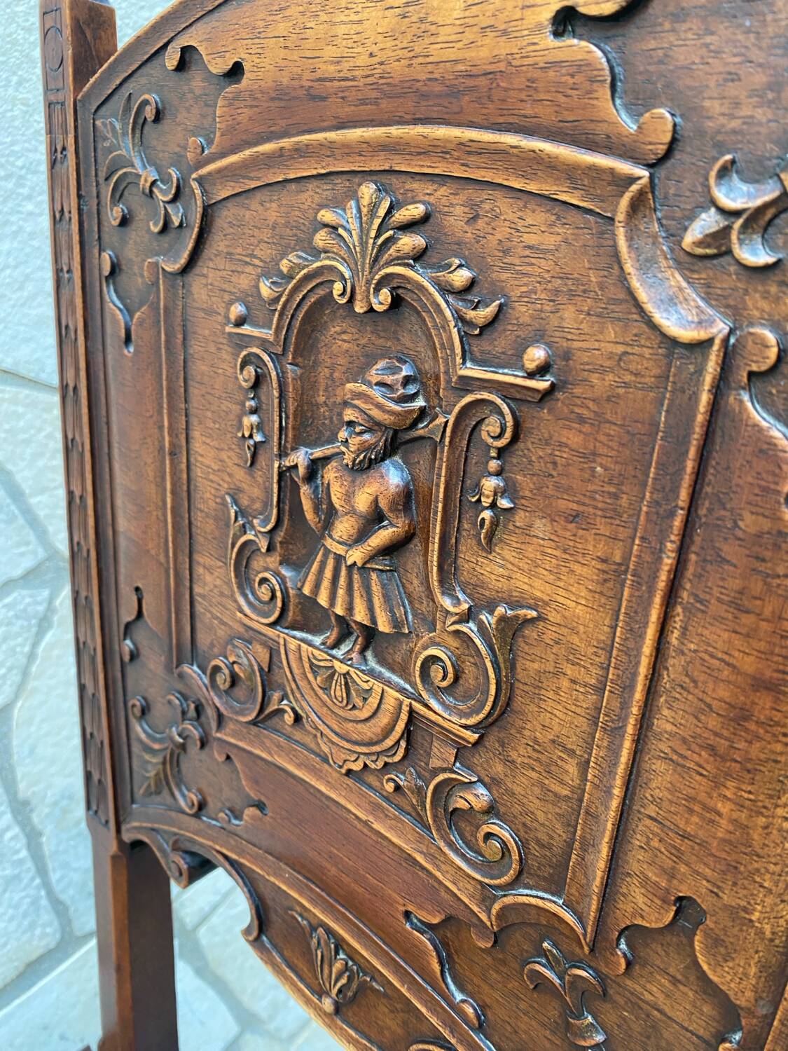 Carved walnut lounge chair