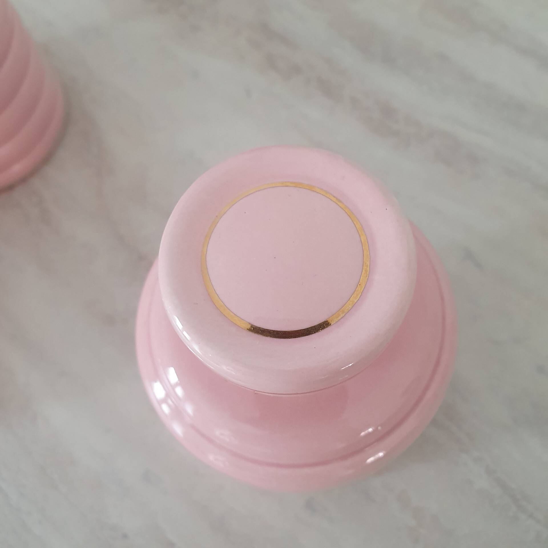 Set of pink and gold ceramic bathroom accessories