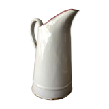 Old pitcher in enamelled sheet metal
