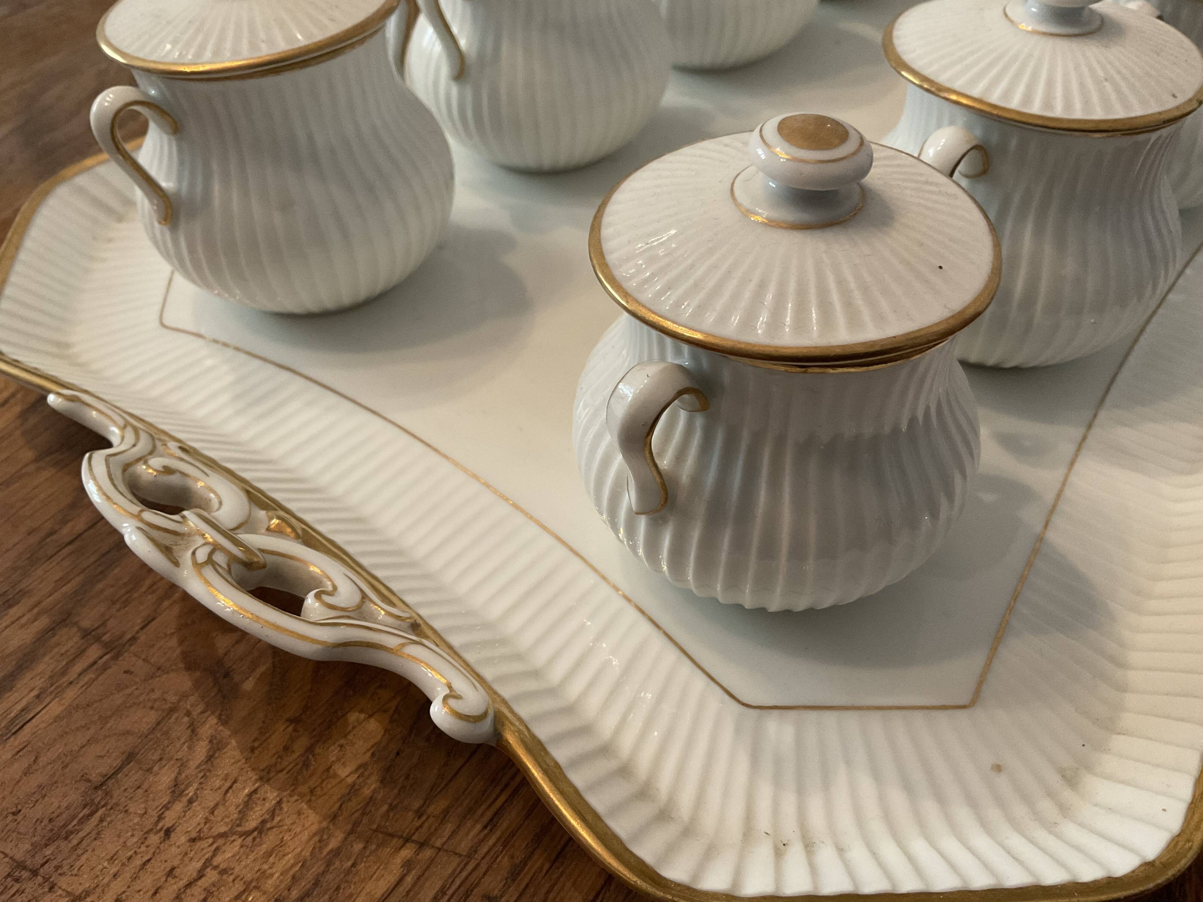 Porcelain tray and 8 matching cream pots. Antique