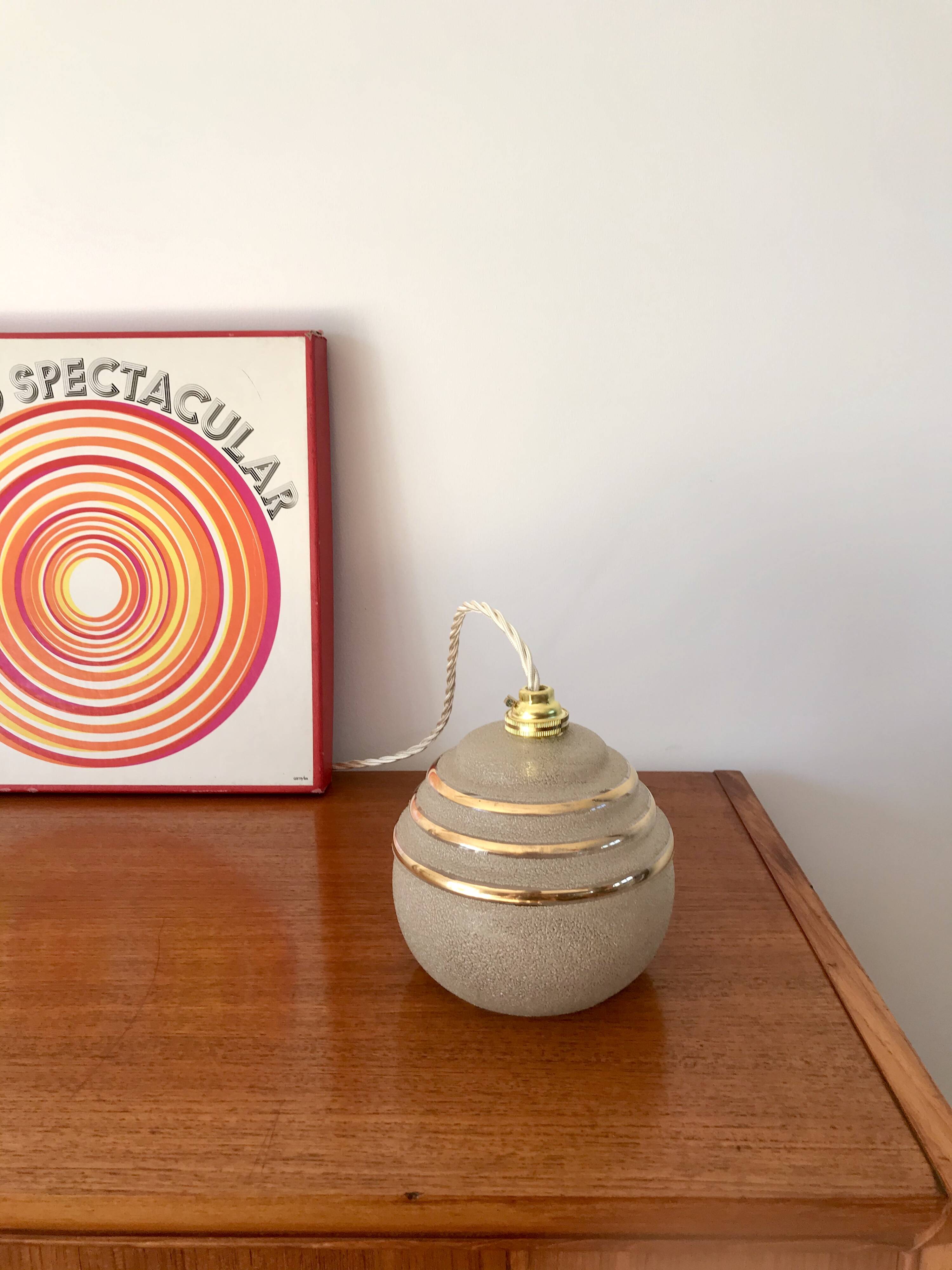 ball pendant light in white granite glass and gold edging from the 1950s