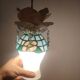 Creation of a rose on stained glass with pendants and opaline.