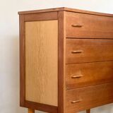 Vintage 1960s chest of drawers with covered handles.
