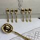 Dessert spoons and serving ladle