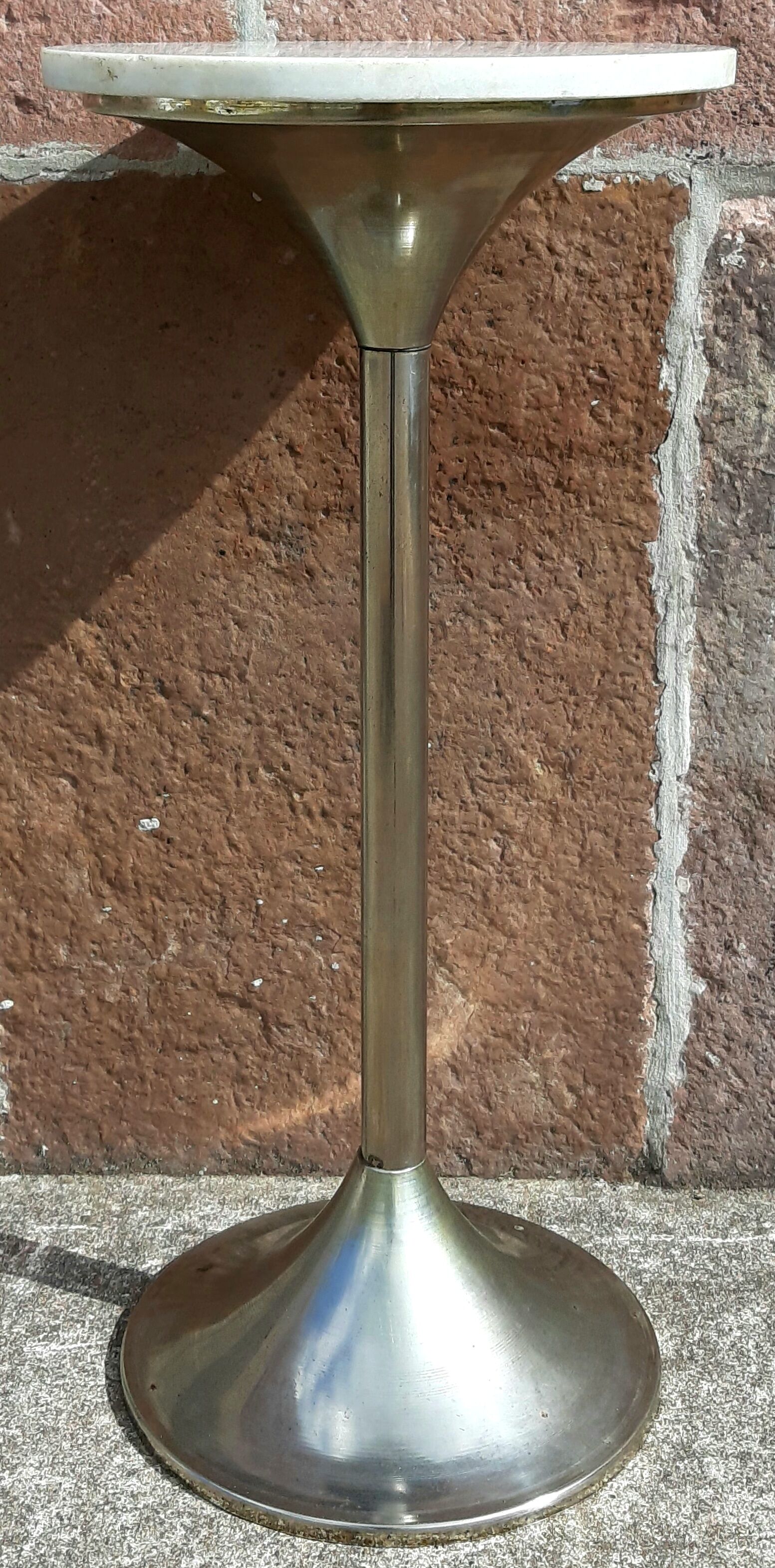 Golden metal selette on marble