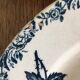 2 old flat plates decorated with dark blue roses in earthenware. Two different settings