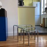 Nesting tables in chrome metal and white glass