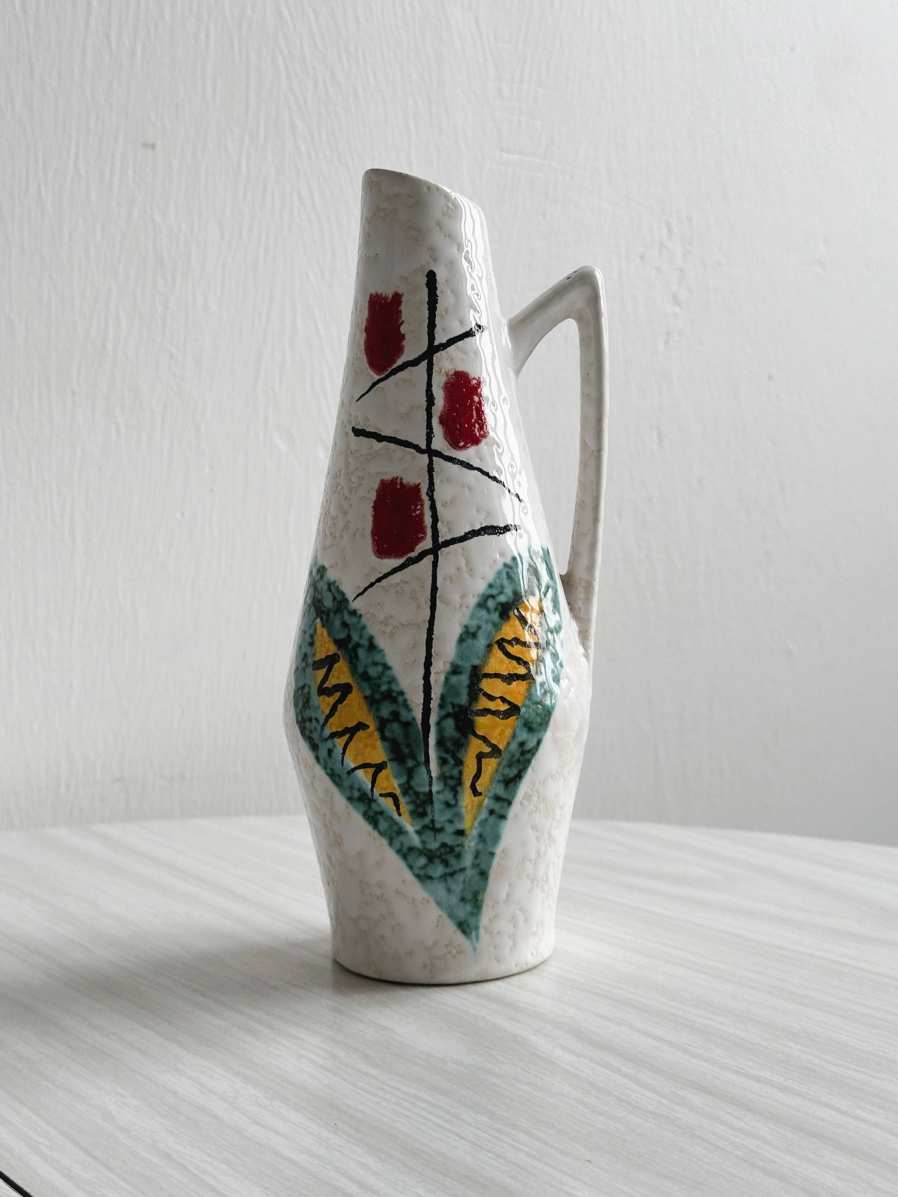 Ceramic flower pitcher.