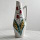 Ceramic flower pitcher.