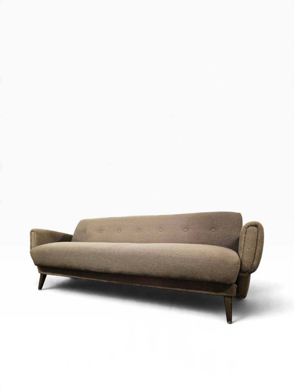 Vintage armchair/sofa/lounge in taupe colour with a stain.
