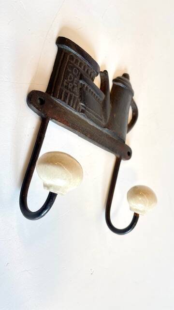 Coat rack made of steel and porcelain
