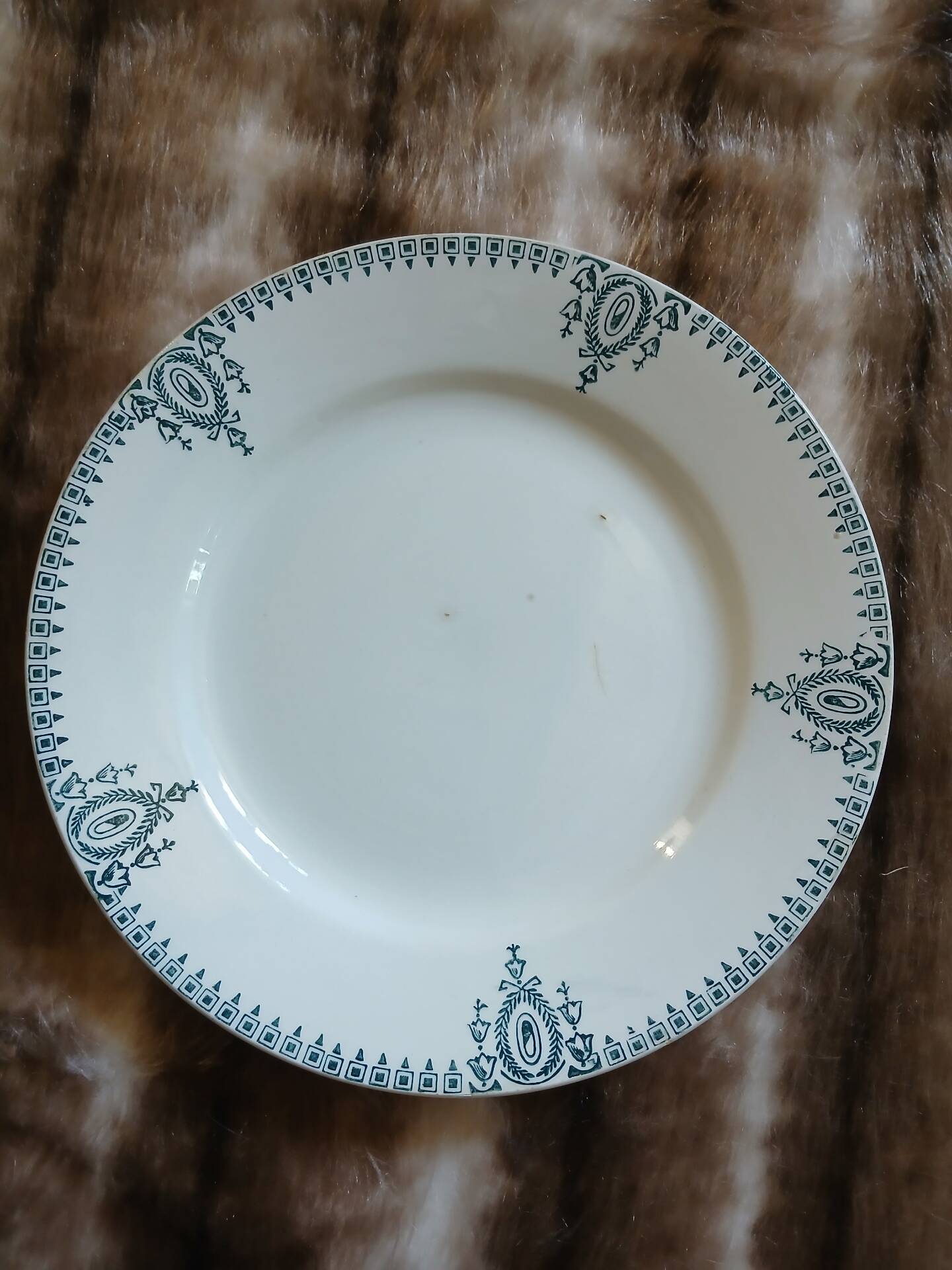 13 mismatched flat plates in ironstone
