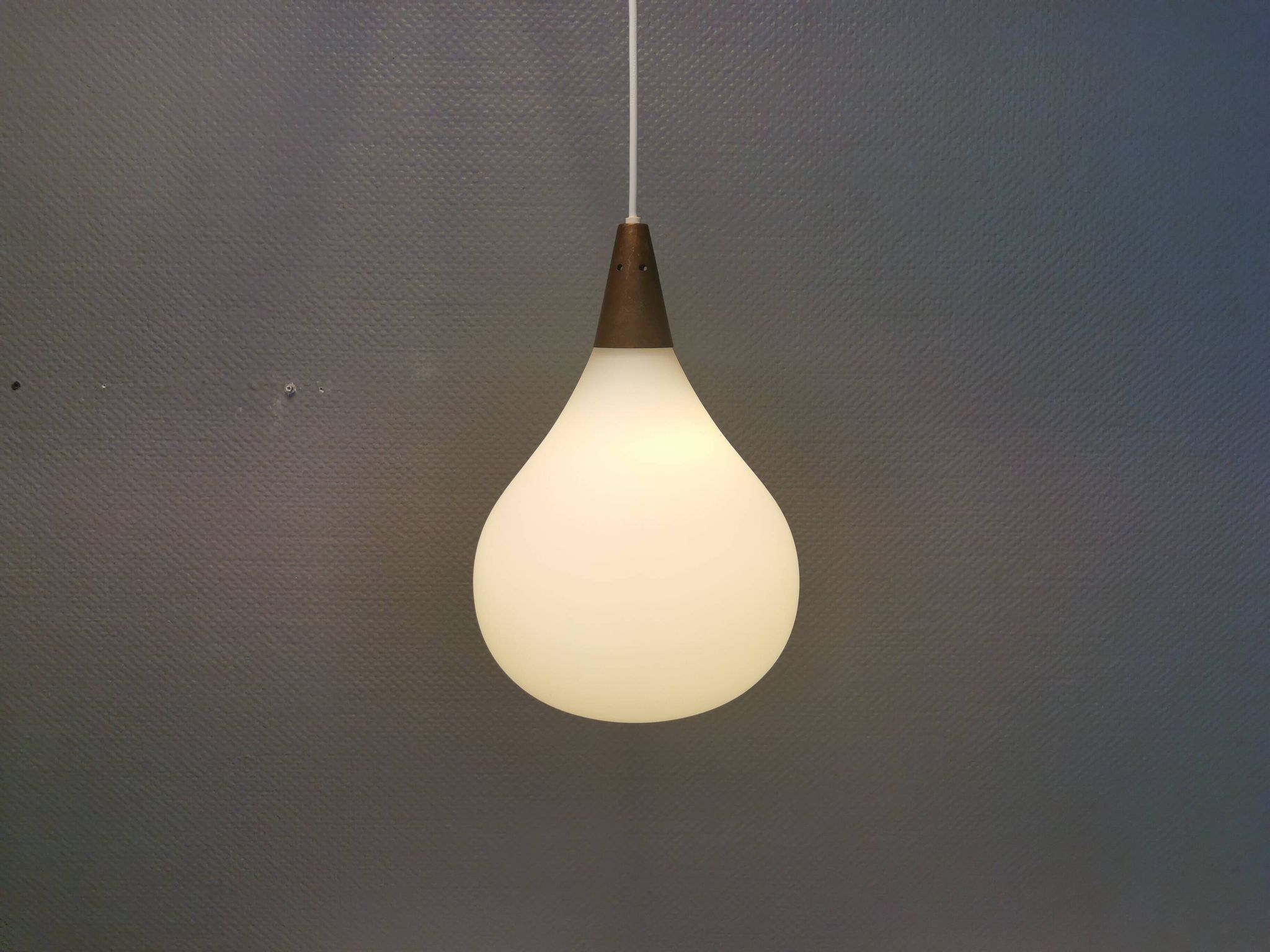 Large hanging lamp in white opal glass with brass top. Danish and estimated from the 1970s.