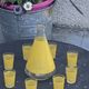 Liqueur service composed of a glass carafe and 8 small yellow screen-printed glasses