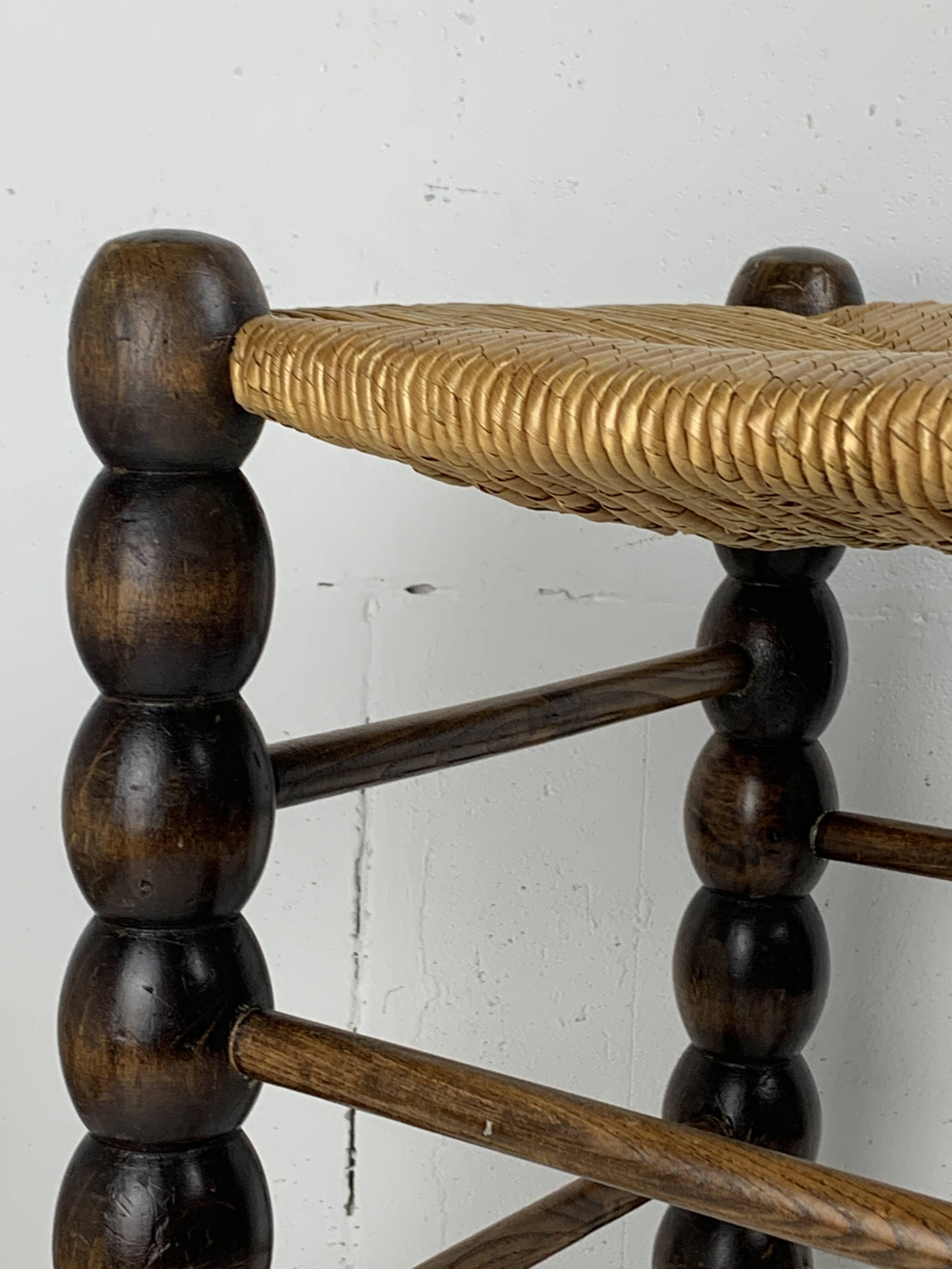 Brutalist wood turned bobbin rush stool in the style of Charles Dudouyt