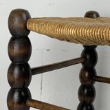 Brutalist wood turned bobbin rush stool in the style of Charles Dudouyt