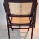 Pair of caned folding chairs from the 1960s in varnished wood.