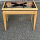 Adjustable piano stool in light beech and purple velvet.