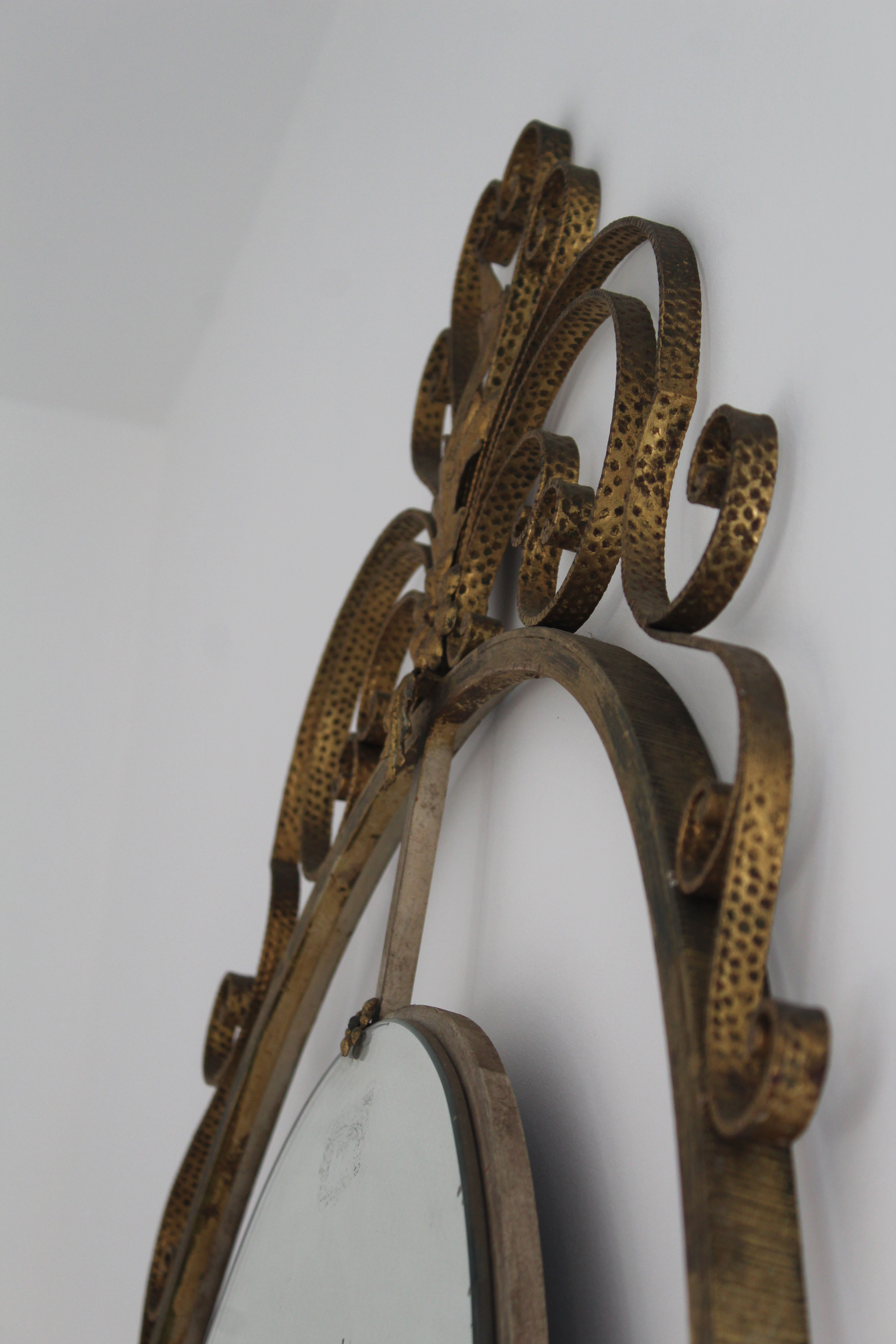 Oval mirror in art deco brass, Italy 1940s.