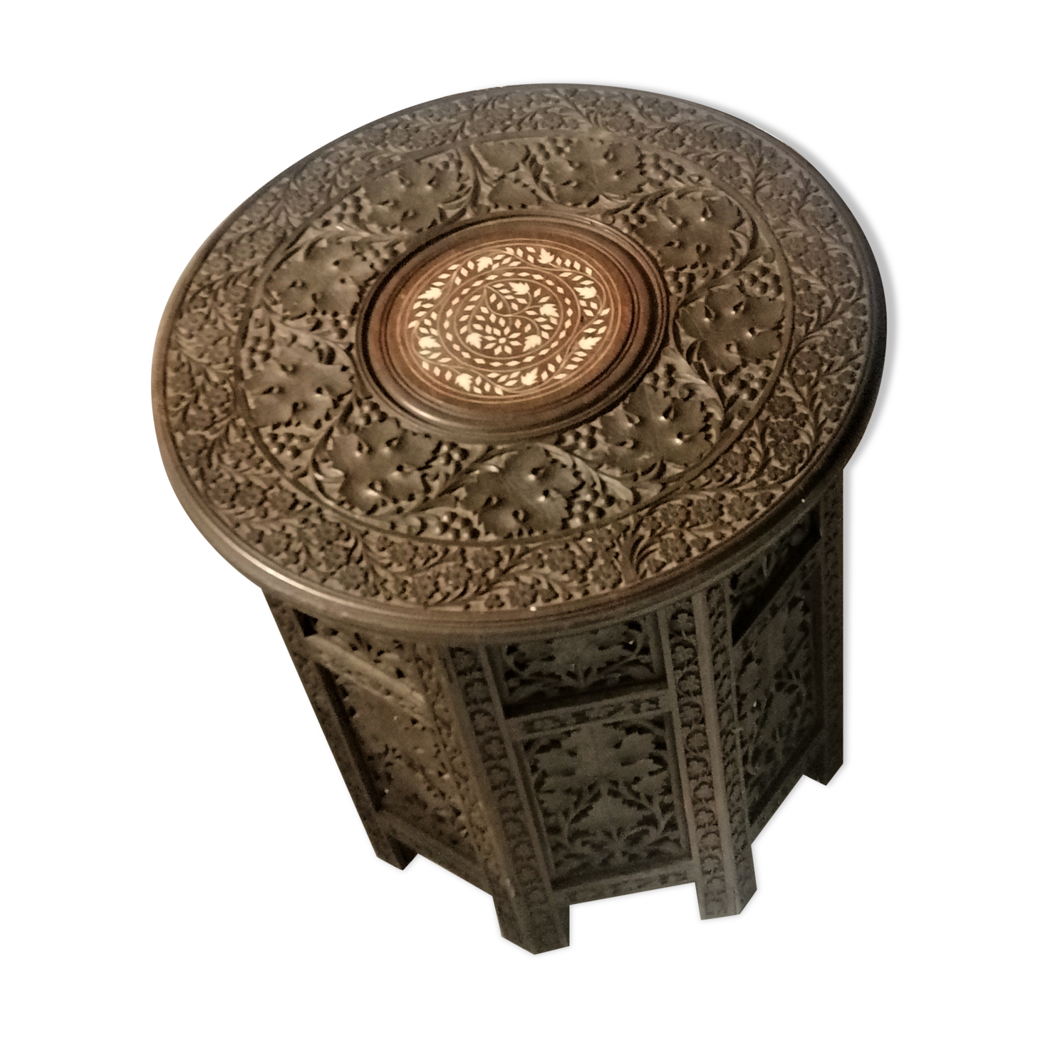 Ancient oriental pedestal table in carved wood