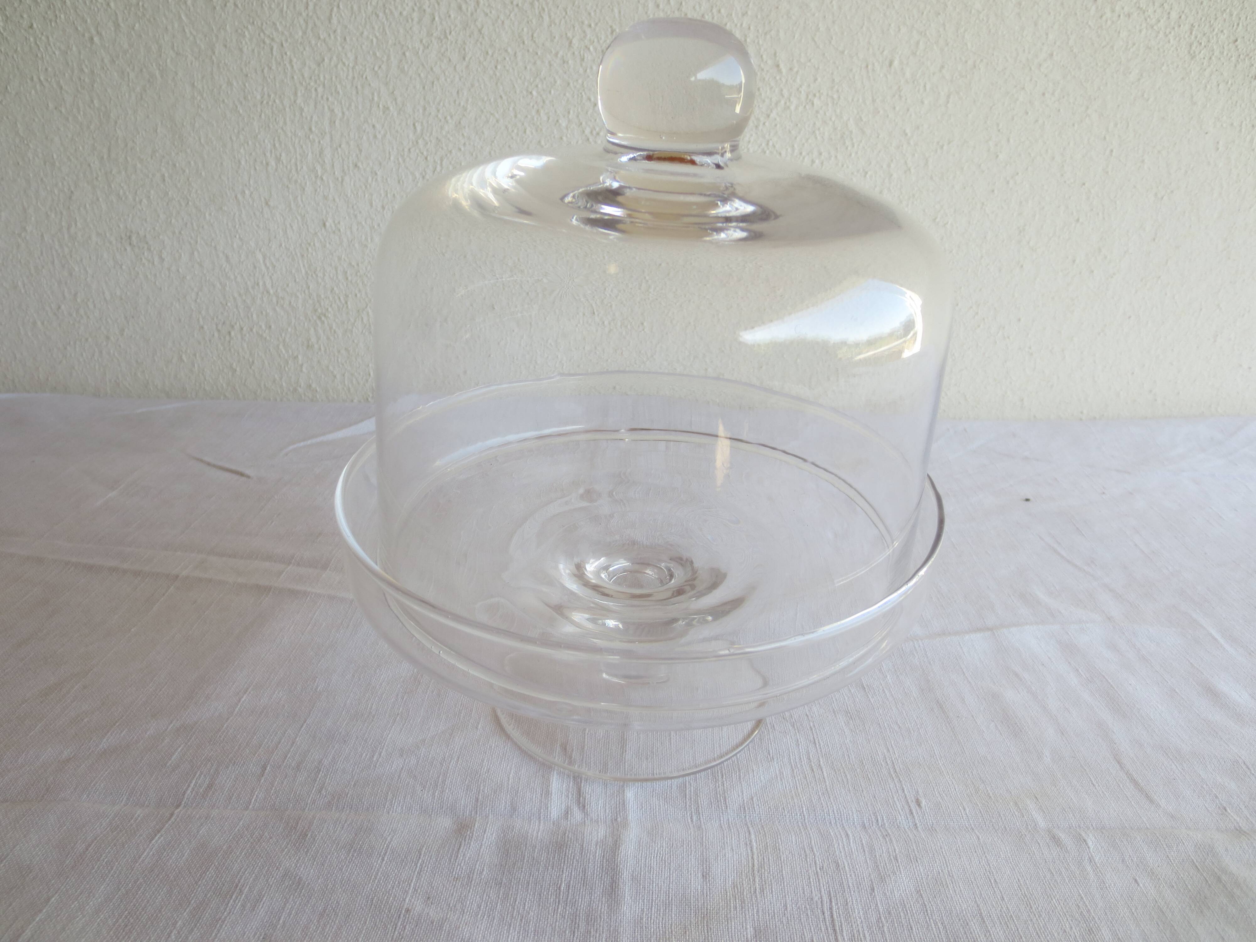 Old glass cake dome on a stand