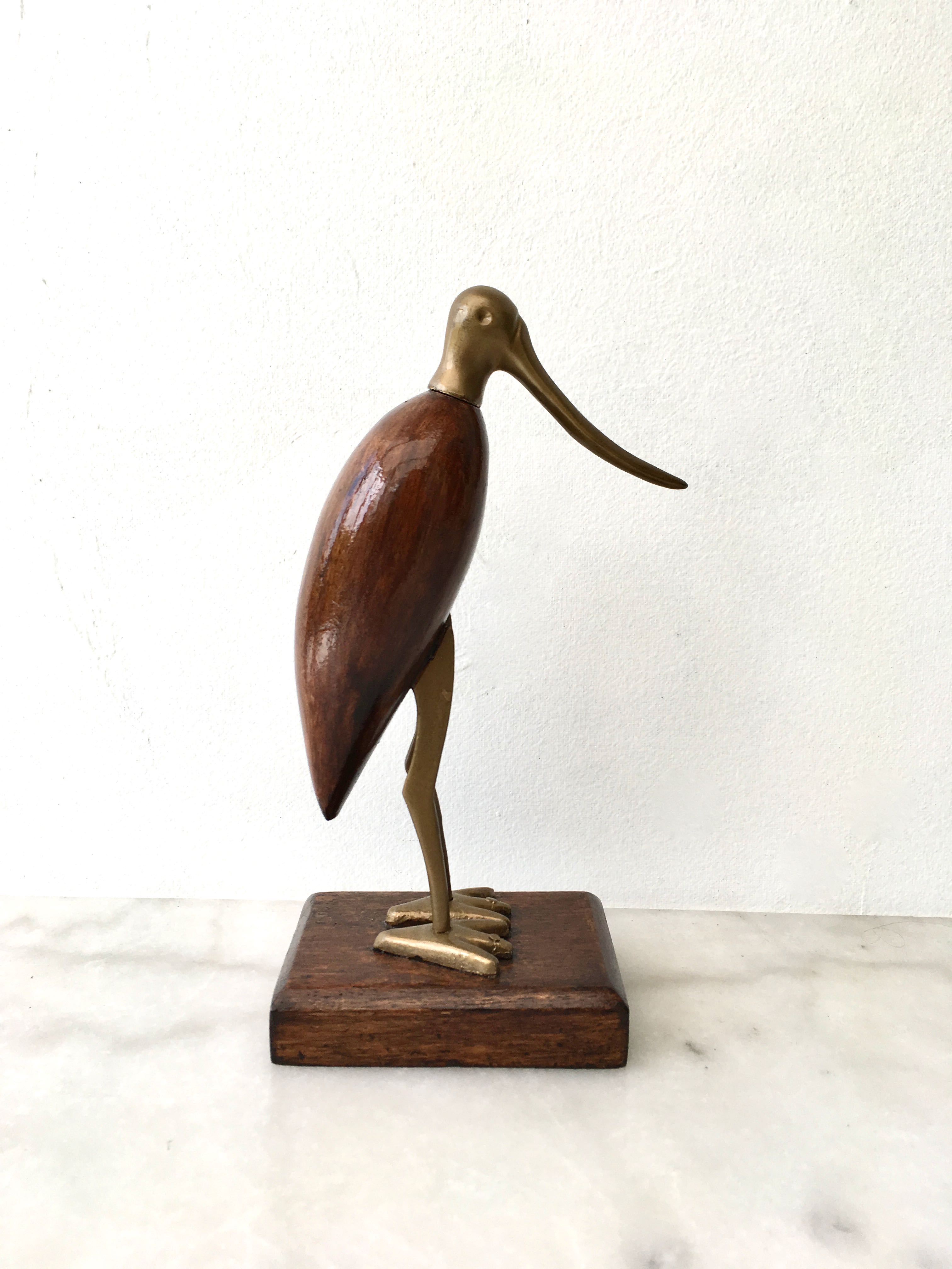 Animal marabout in teak and brass