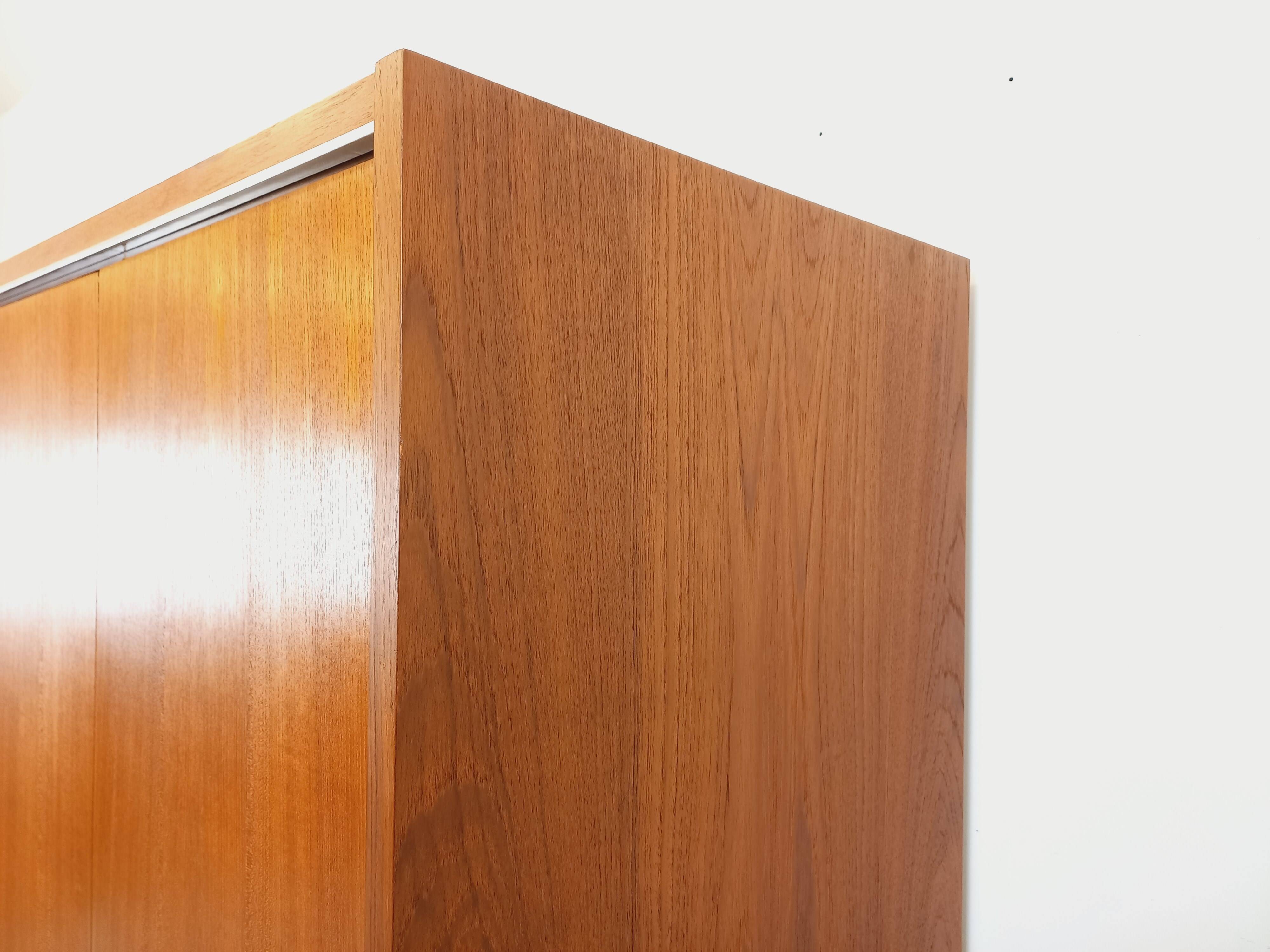 Vintage Scandinavian modernist wardrobe in teak and metal from the 1960s.