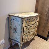 Serpentine commode, 18th century style, Italian, painted and gilded with patterns.