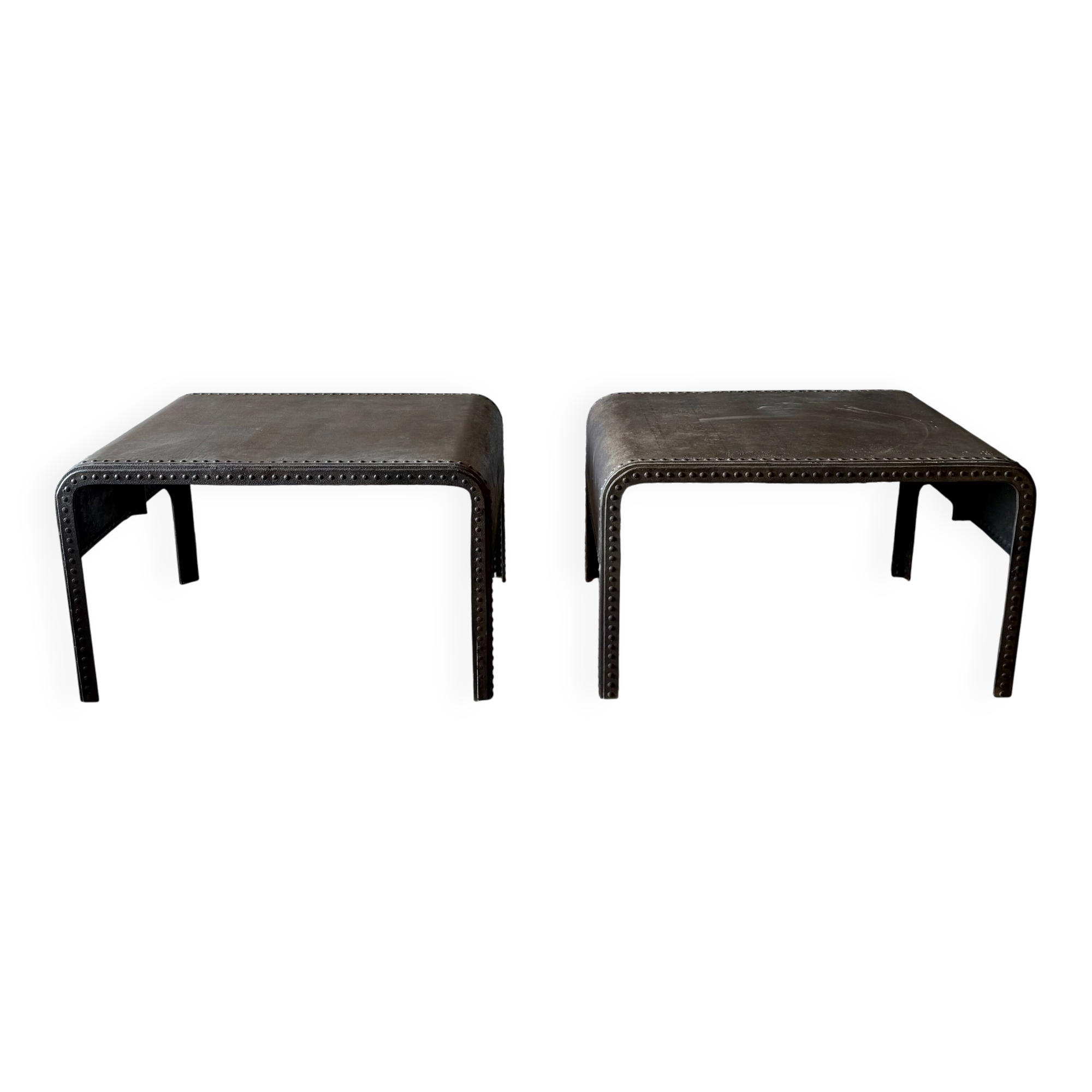 Pair of large riveted metal industrial tables