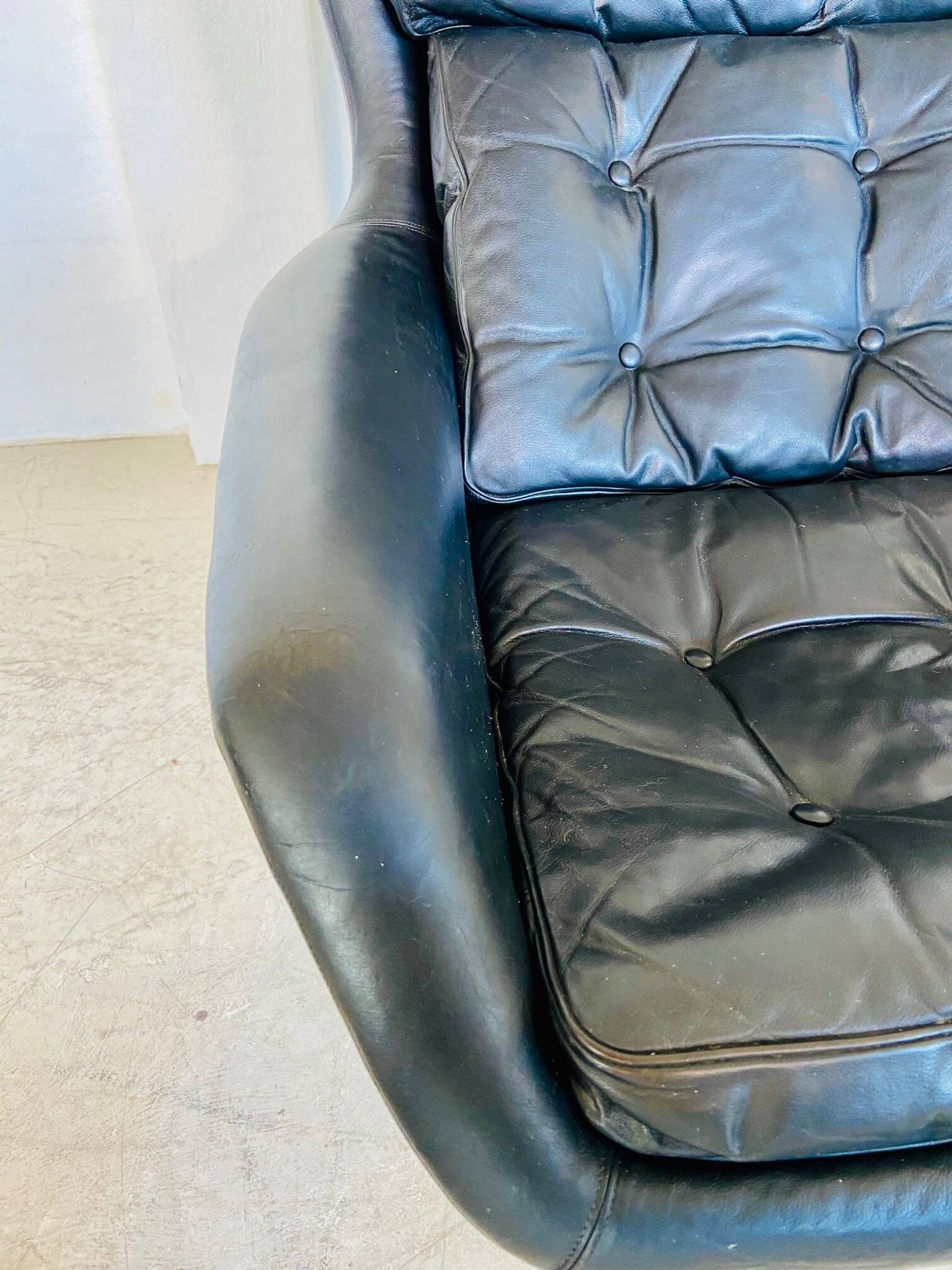 Vintage Danish swivel chair in black leather by Bramin