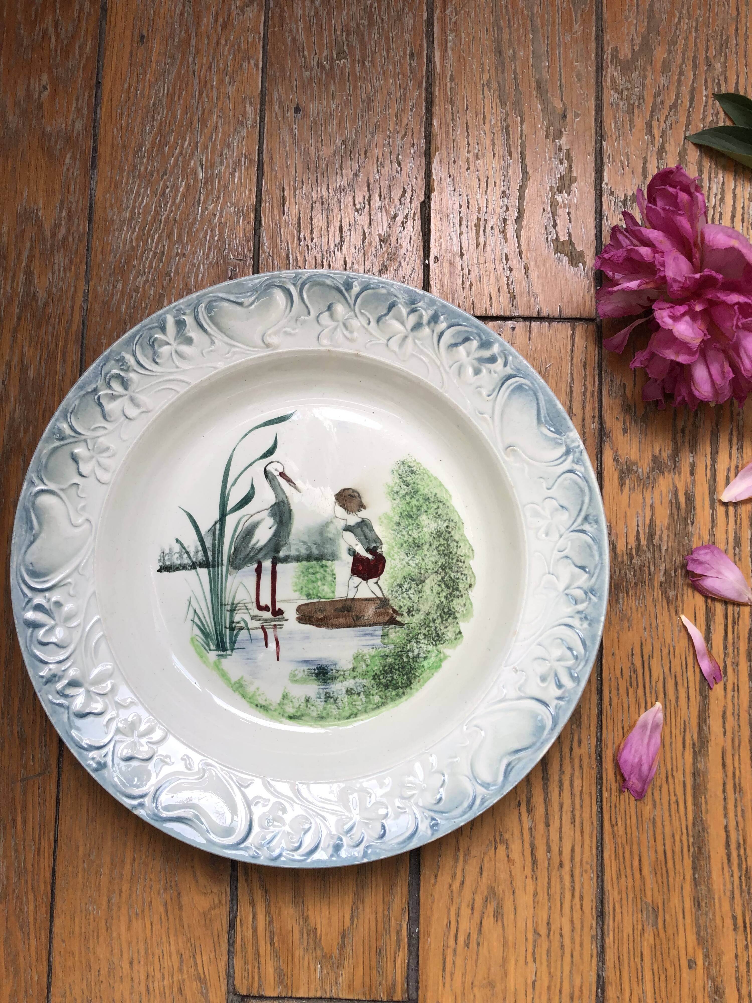 Vintage hollow serving dish with a decoration: marsh landscape.