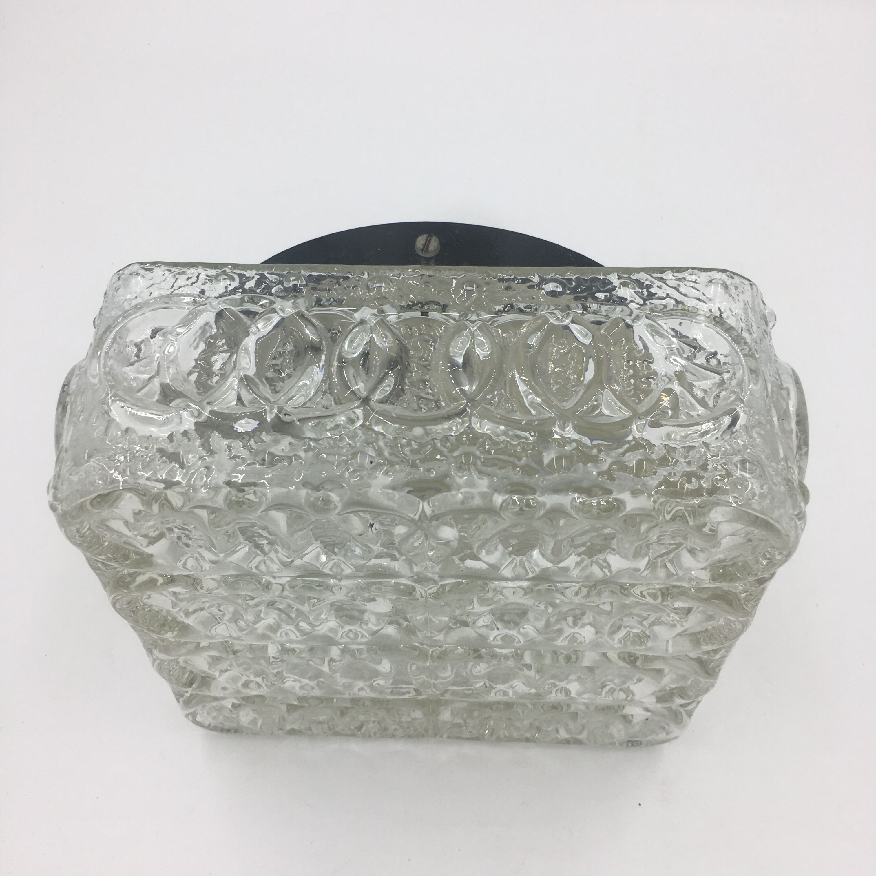 Ceiling lamp in molded glass in relief