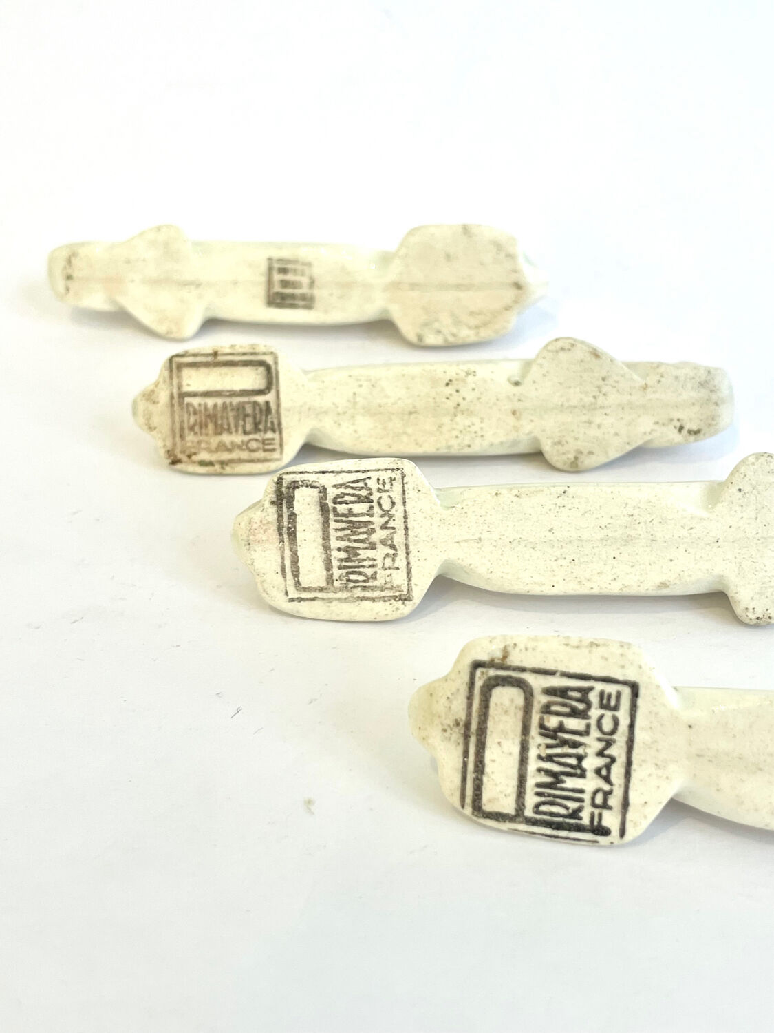 Set of 4 Art Deco knife rests, Primavera workshop