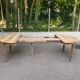 Art Deco round extendable dining table stripped in solid walnut from the 1920s.