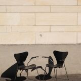 Pair of Jacobsen black Series 7 chairs with armrests