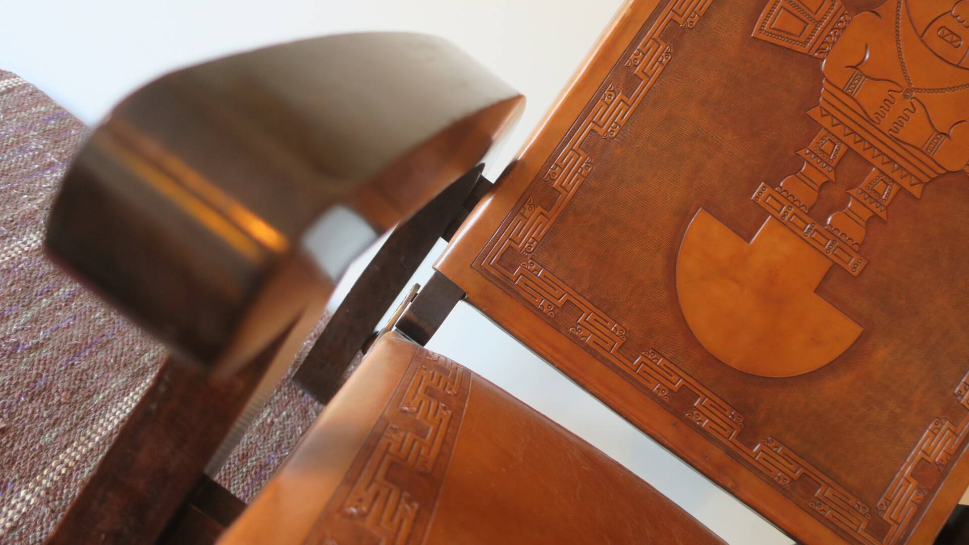 Tiahuanaco design tooled leather folding armchair by Angel Pazmino, Ecuador