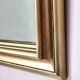 Miroir ancien en bois doré et cuivré