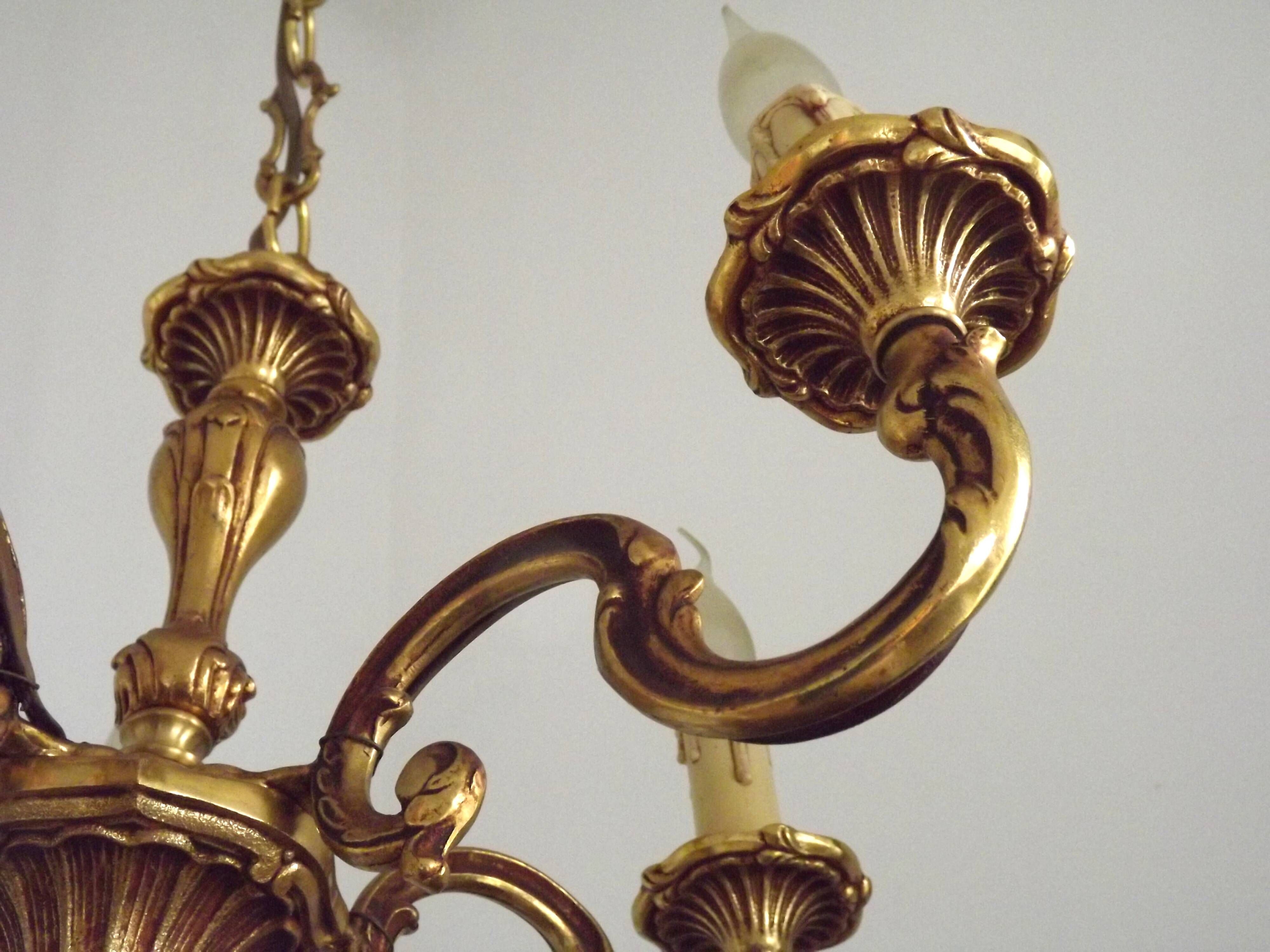 Vintage French traditional style bronze chandelier with 5 lights featuring acanthus leaf details.