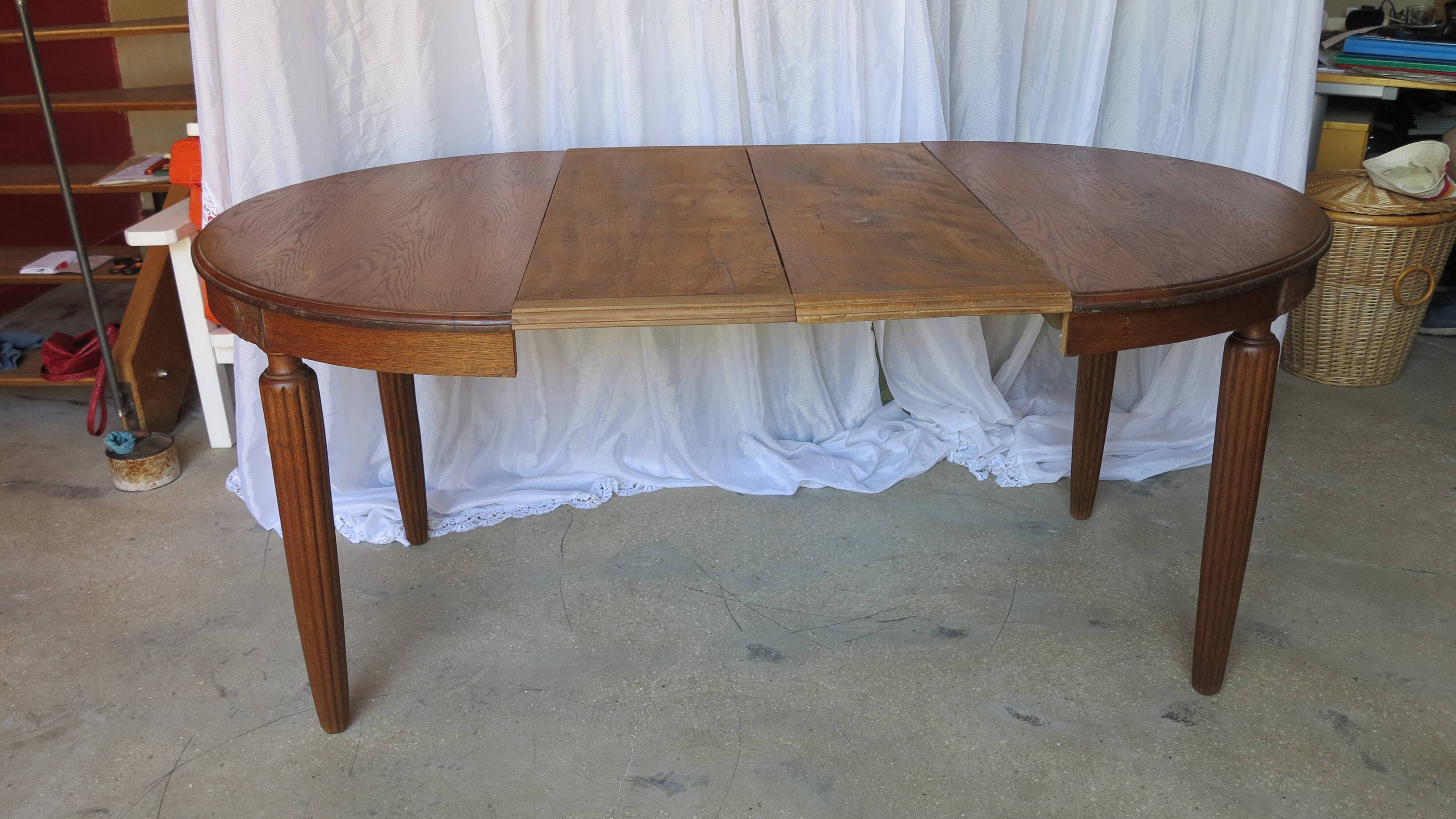 1930s oak dining table, slightly oval.