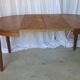 1930s oak dining table, slightly oval.