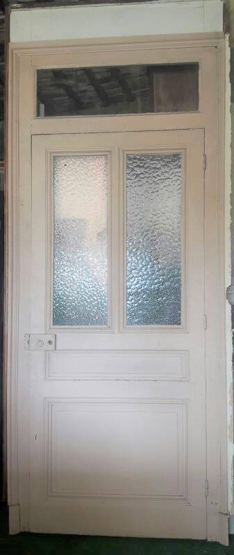 Large glazed door and its old glazed transom.
