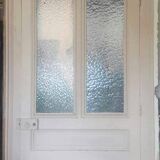 Large glazed door and its old glazed transom.