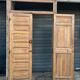 pair of old double-leaf doors with transom and carved frames