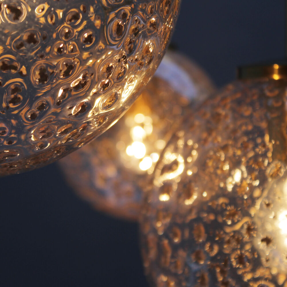 Four gold fleck globe pendants by Doria Germany