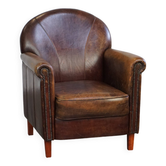 Beautifully and properly finished designer armchair made of sheepskin leather