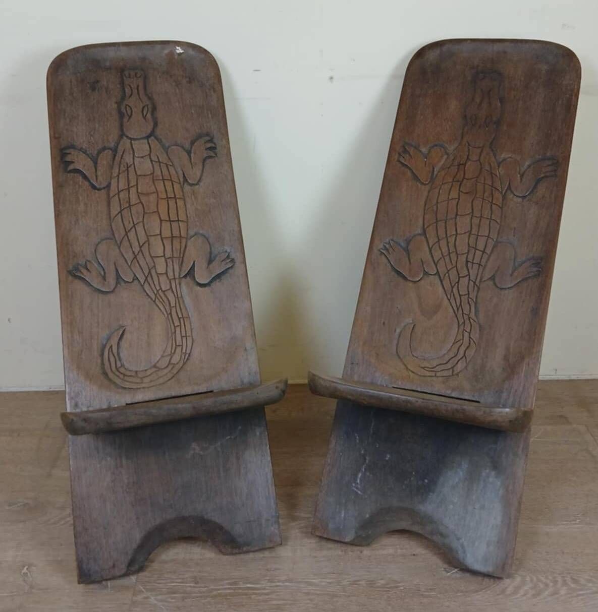 Central Africa circa 1950: pair of exotic wood chairs decorated with crocodile sculptures