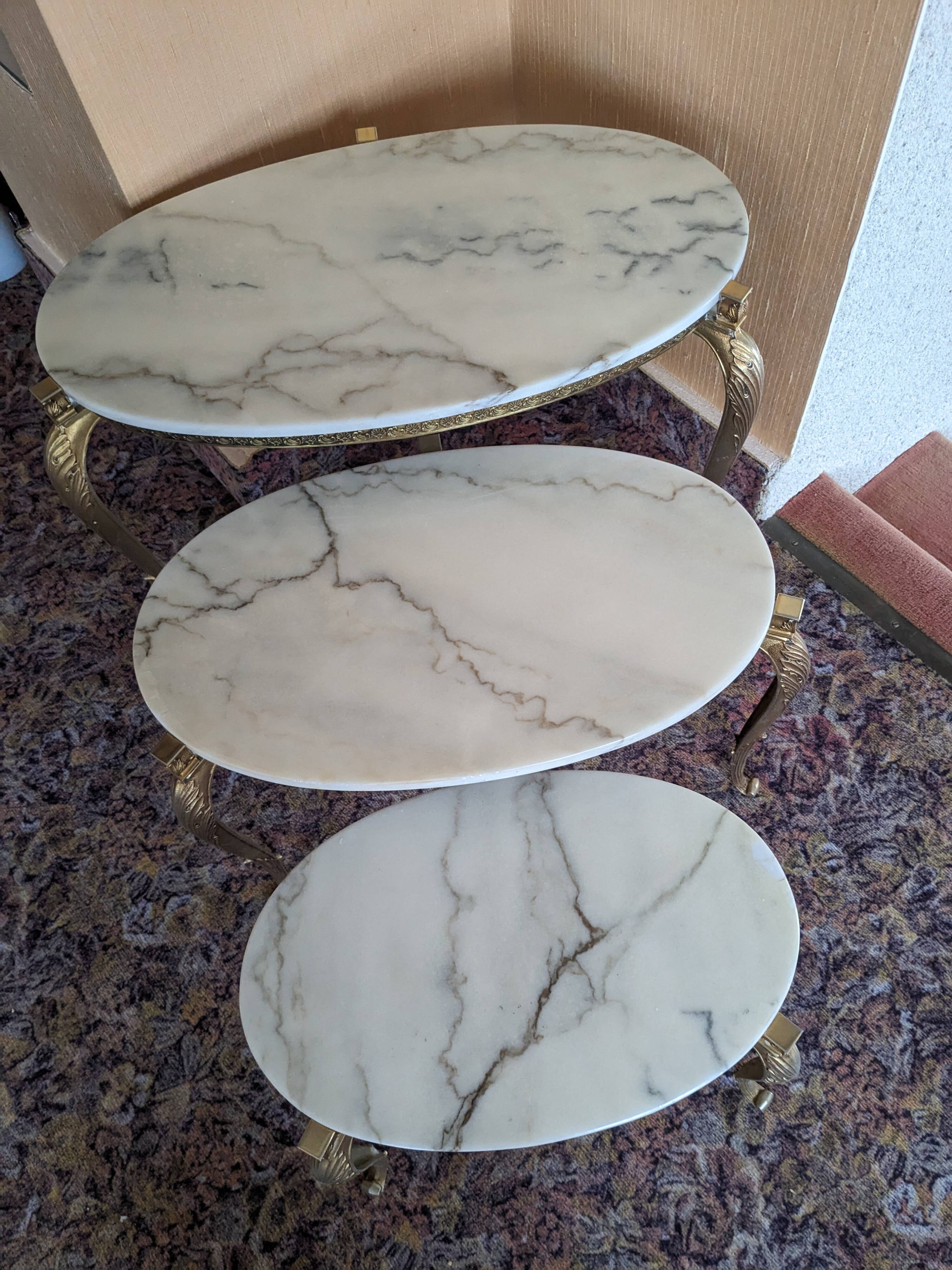 Nesting tables in white marble and bronze