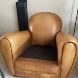 Brown leather club armchairs with an antique finish.